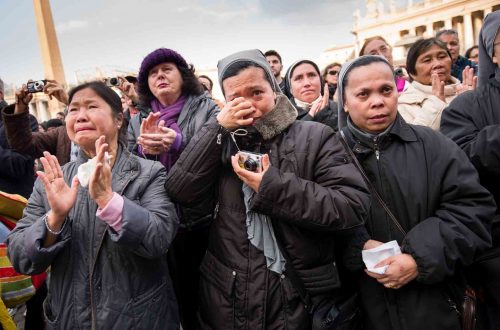Vatican City, Rome, Italy; 28 feb 2013, People in S.Peter´s squeare sayng goodbye to Pope Benedict XVI. He left the Vatican by helicopter on Thursday afternoon to spend the final hours of his nearly eight-year, scandal-dogged papacy at the papal summer residence. Onlookers in St. Peter’s Square cheered, church bells rang and Romans stood on rooftops to wave flags as he flew from Rome to Castel Gandolfo, a hilltop town southeast of the city where popes have summered for centuries.