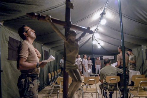 Jul 2004. Cap Haitien, chilenan soldiers prayng in the camp
Lorenzo Moscia/GraziaNeri