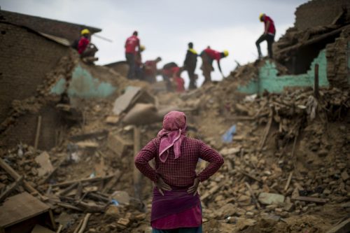 Nepal, 18 may 2015.People are cleaning up the rest of destroied houses in Dharmasthali.