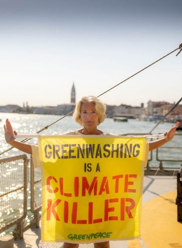Emma Thompson on board the Greenpeace Rainbow Warrior in Venice supports the European Citizens’ Initiative (ECI) to ban fossil fuel advertisements and sponsorships in the European Union holding a banner against greenwashing.