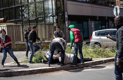 Rome, Italy, 16/4/2014.Several people have been injured in Rome as clashes erupted while Italian police evicted 350 squatter families caught up in the country's economic crisis. 350 families are locked on the roof of an occupied building.Riot police get ready to drag away some 350 squatter families from abandoned offices in Rome