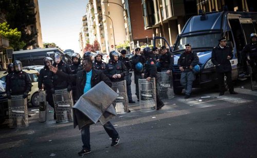 Rome, Italy, 16/4/2014.350 families are locked on the roof of an occupied building.Riot police get ready to drag away some 350 squatter families from abandoned offices in Rome