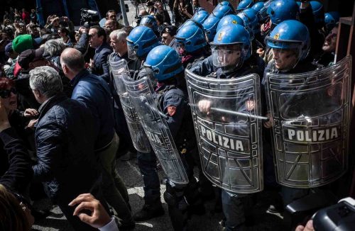 Rome, Italy, 16/4/2014.Several people have been injured in Rome as clashes erupted while Italian police evicted 350 squatter families caught up in the country's economic crisis. 350 families are locked on the roof of an occupied building.Riot police get ready to drag away some 350 squatter families from abandoned offices in Rome